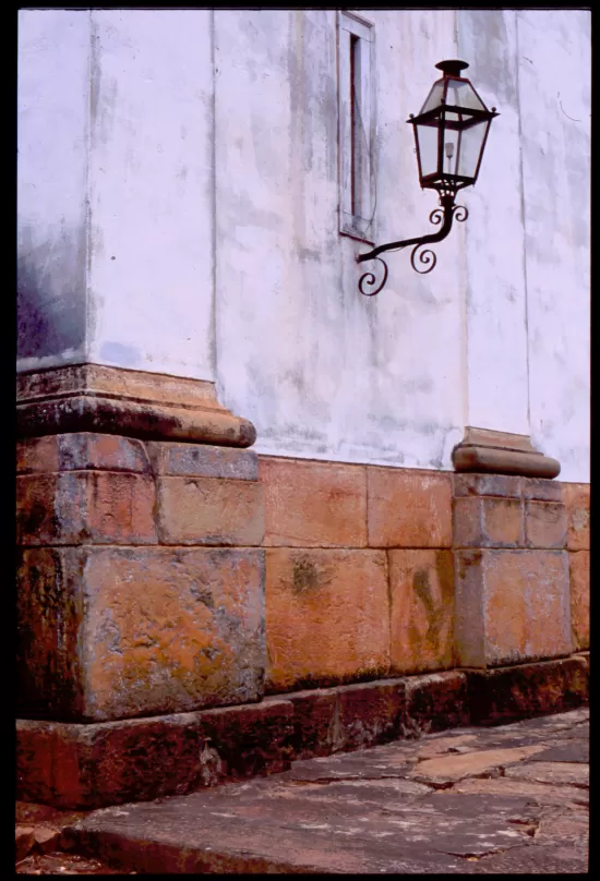 White pilasters with iron lamp