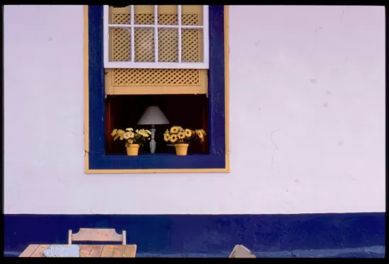 White wall with blue window