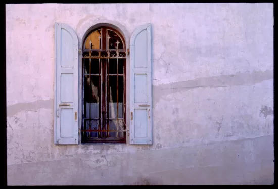 Areched window with open shutters